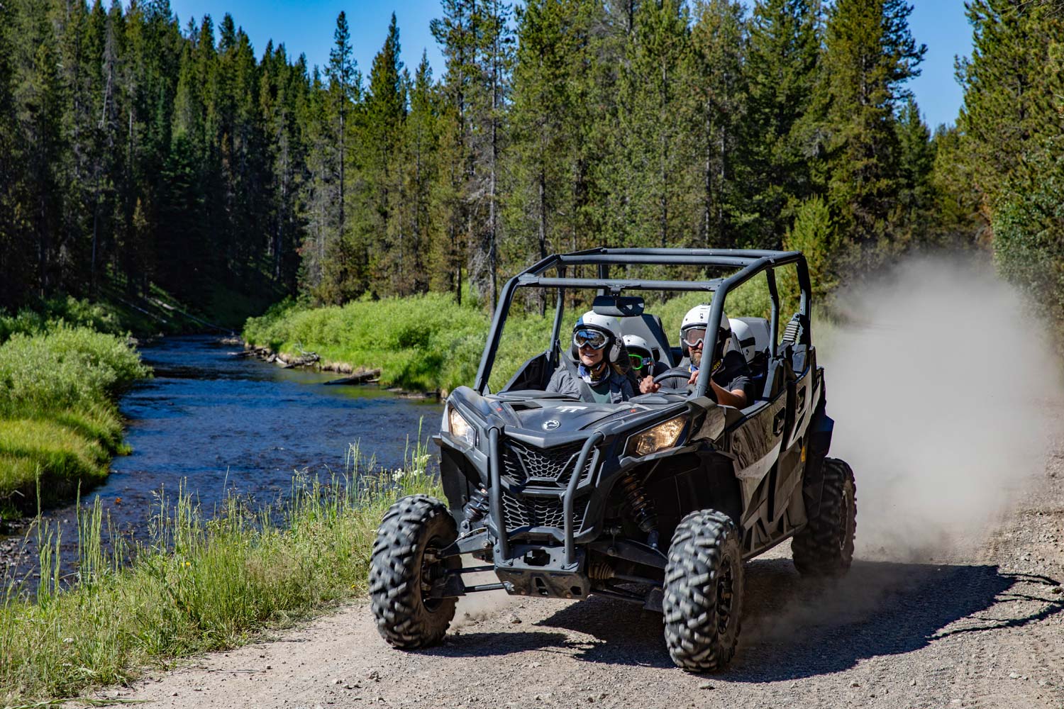 Yellowstone visitors exploring a trail in a side-by-side off road vehicle